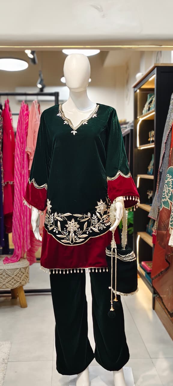 Velvet Pakistani co-ord set with tassels and heavy embroidery and matching potli Reyshaa