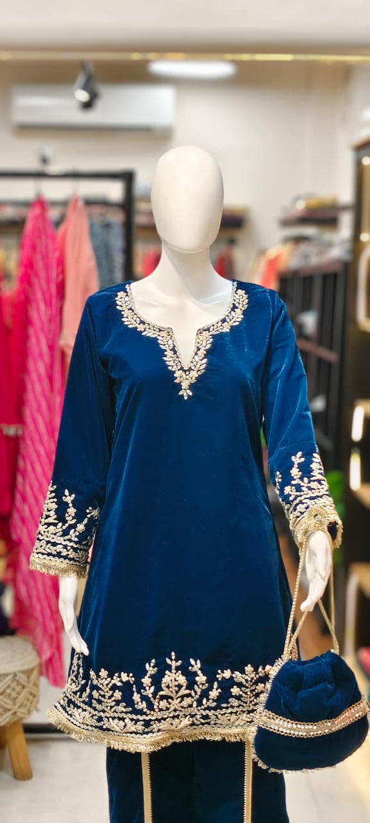 Velvet Pakistani co-ord set with shell tassels and heavy embroidery and matching potli Reyshaa